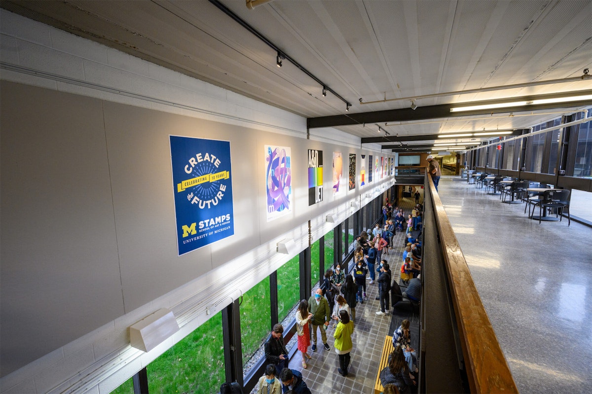 A large number of people gathered in the STamps first floor street gallery
